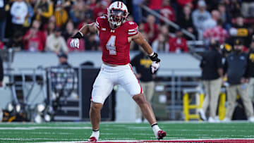 Oct 11, 2025; Madison, Wisconsin, USA; Wisconsin Badgers linebacker Tackett Curtis (4) celebrates a defensive stop against the Iowa Hawkeyes in the first quarter at Camp Randall Stadium. Mandatory Credit: Ross Harried-Imagn Images