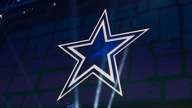 The Dallas Cowboys logo is projected on the video board during the NFL Draft at Lambeau Field.