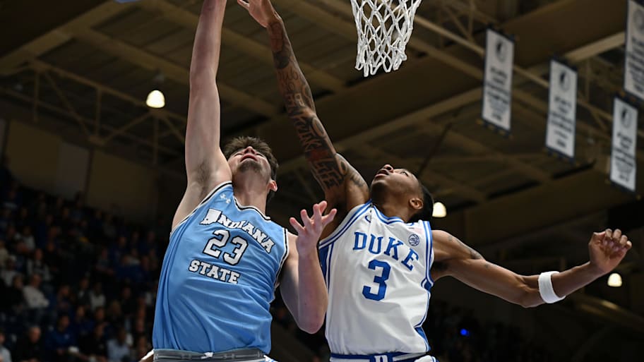Duke forward Isaiah Evans defends as Indiana State forward Ian Scott goes for a layup.