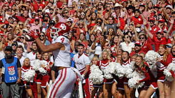 Fans watch as Sooners wide receiver Nic Anderson (4) catches a touchdown in the final seconds of the Red River Rivalry between the Oklahoma Sooners and the Texas Longhorns at the Cotton Bowl in Dallas, Saturday, Oct. 7, 2023. Oklahoma won 34-30.