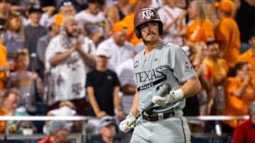 Jun 24, 2024; Omaha, NE, USA; Texas A&M Aggies designated hitter Hayden Schott (5) walks off after striking out against the Tennessee Volunteers during the ninth inning at Charles Schwab Field Omaha. Mandatory Credit: Dylan Widger-Imagn Images