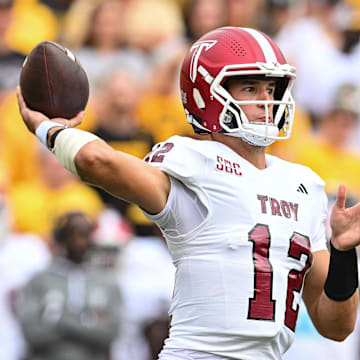 Sep 14, 2024; Iowa City, Iowa, USA; Troy Trojans quarterback Matthew Caldwell (12) throws a pass during the first quarter against the Iowa Hawkeyes at Kinnick Stadium. Mandatory Credit: Jeffrey Becker-Imagn Images