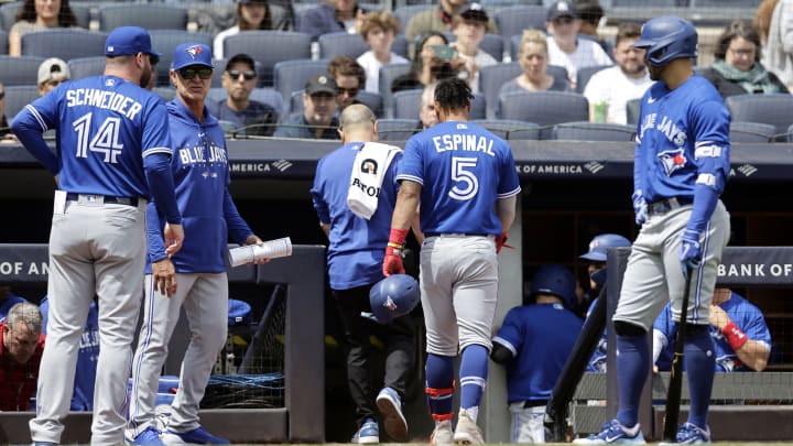 Santiago Espinal leaves the game after hit-by-pitch