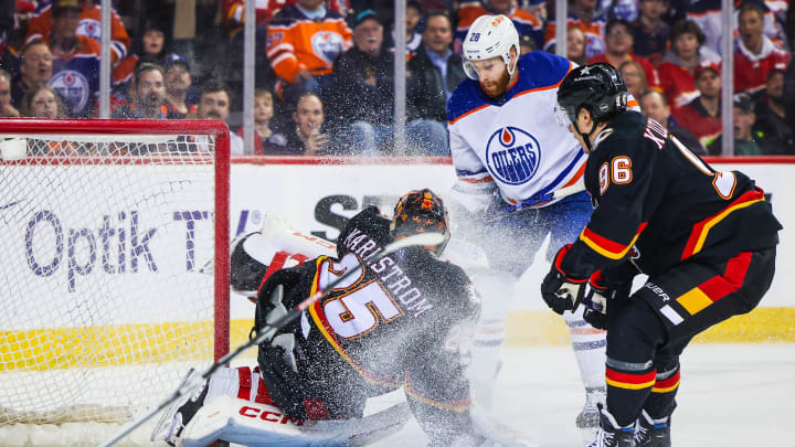 Calgary Flames goaltender Jacob Markstrom (25) makes a save on Edmonton Oilers Connor Brown (28)