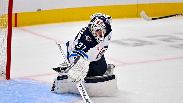 Apr 2, 2026; Dallas, Texas, USA; Winnipeg Jets goaltender Connor Hellebuyck (37) makes a stick save during the first period against the Dallas Stars at the American Airlines Center. Mandatory Credit: Jerome Miron-Imagn Images