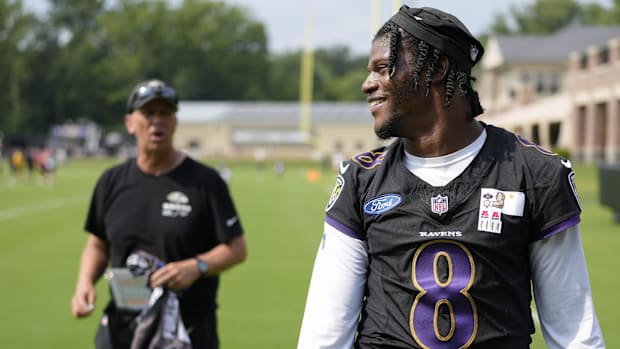 Baltimore Ravens offensive coordinator Todd Monken and Ravens quarterback Lamar Jackson