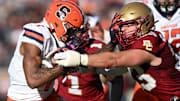 Nov 9, 2024; Chestnut Hill, Massachusetts, USA; Syracuse Orange running back LeQuint Allen (1) runs against Boston College Eagles linebacker Owen McGowan (33) during the second half at Alumni Stadium. Mandatory Credit: Brian Fluharty-Imagn Images