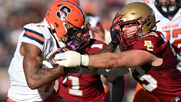 Nov 9, 2024; Chestnut Hill, Massachusetts, USA; Syracuse Orange running back LeQuint Allen (1) runs against Boston College Eagles linebacker Owen McGowan (33) during the second half at Alumni Stadium. Mandatory Credit: Brian Fluharty-Imagn Images