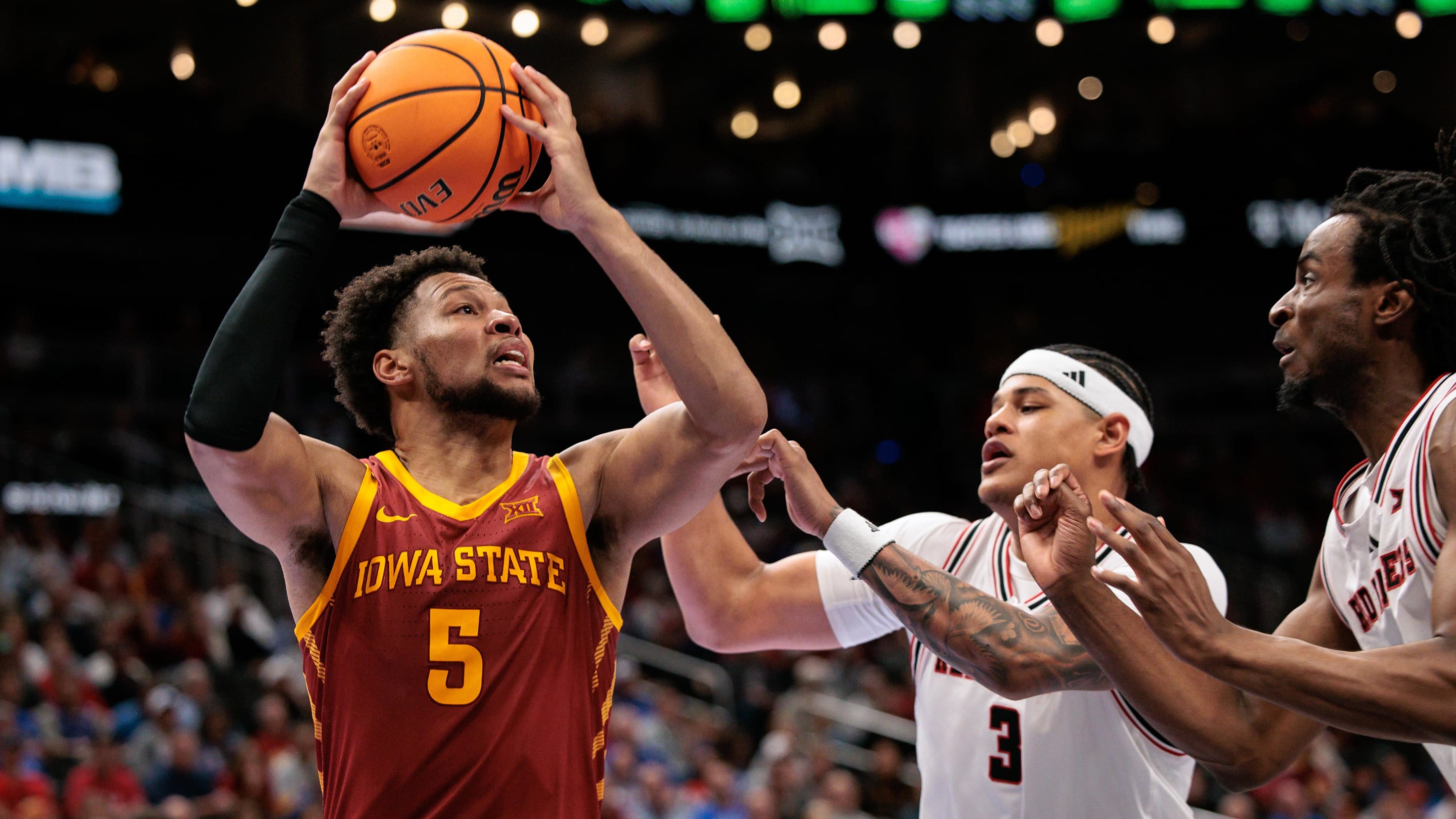 Mar 12, 2026; Kansas City, MO, USA; Iowa State Cyclones forward Joshua Jefferson (5) drives to the basket around Texas Tech Red Raiders forward LeJuan Watts (3) during the second half at T-Mobile Center. Mandatory Credit: William Purnell-Imagn Images
