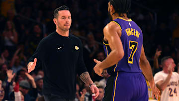  Los Angeles Lakers head coach JJ Redick celebrates with guard Gabe Vincent (7) during the fourth quarter against the LA Clippers at Crypto.com Arena.