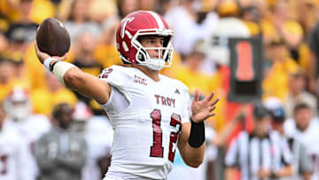 Sep 14, 2024; Iowa City, Iowa, USA; Troy Trojans quarterback Matthew Caldwell (12) throws a pass during the first quarter against the Iowa Hawkeyes at Kinnick Stadium. Mandatory Credit: Jeffrey Becker-Imagn Images