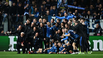 Atalanta players pose for a photo after defeating Liverpool in a Europa League quarterfinal series.