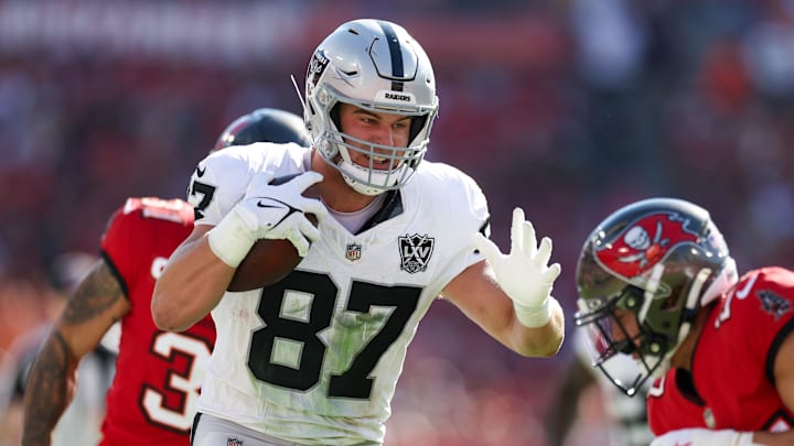 Dec 8, 2024; Tampa, Florida, USA; Las Vegas Raiders tight end Michael Mayer (87) runs with the ball against the Tampa Bay Buccaneers in the second quarter at Raymond James Stadium. Mandatory Credit: Nathan Ray Seebeck-Imagn Images