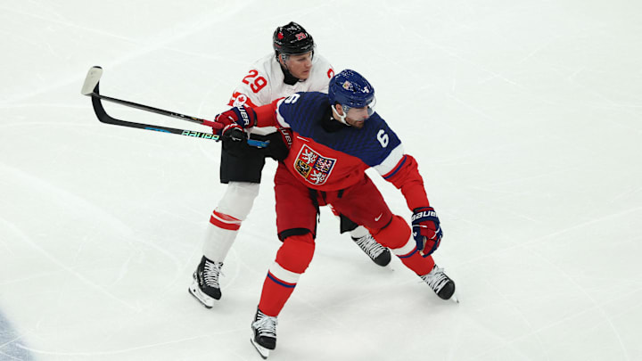 [US, Mexico & Canada customers only] Feb 12, 2026; Milan, Italy; Michal Kempny of Czechia in action with Nathan Mackinnon of Canada  in a men's ice hockey Group A match during the Milano Cortina 2026 Olympic Winter Games at Milano Santagiulia Ice Hockey Arena. Mandatory Credit: Mike Segar/Reuters via Imagn Images