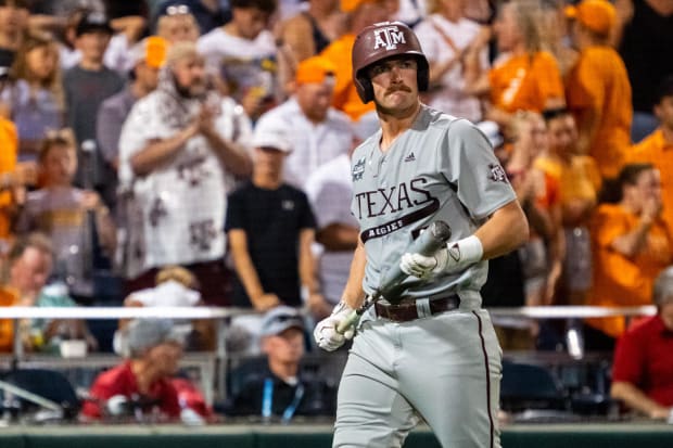 exas A&M Aggies designated hitter Hayden Schott (5) walks off after striking out against the Tennessee Volunteers.