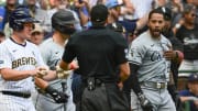 Jun 2, 2024; Milwaukee, Wisconsin, USA; Chicago White Sox left fielder Tommy Pham (28) is restrained by umpires after exchanging words with Milwaukee Brewers catcher William Contreras in the eighth inning at American Family Field.
