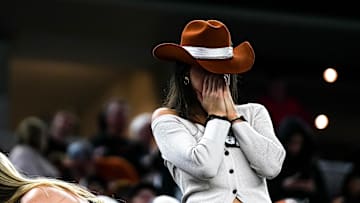 A Texas Longhorns fan reacts to a turnover on 4th and goal during the College Football Playoff semifinal game against Ohio State in the Cotton Bowl at AT&T Stadium on Friday, Jan. 10, 2024 in Arlington, Texas.