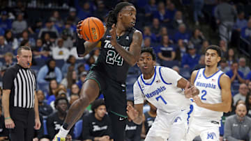 Feb 11, 2024; Memphis, Tennessee, USA; Tulane Green Wave forward Kevin Cross (24) passes the ball as Memphis Tigers forward Nae'Qwan Tomlin (7) defends during the second half at FedExForum. 