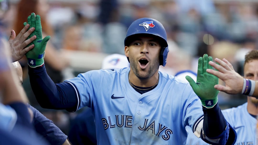 Detroit, Michigan, USA; Toronto Blue Jays outfielder George Springer (4) receives congratulations from teammates after he hits a home run in the ninth inning against the Detroit Tigers at Comerica Park. Detroit, Michigan, USA; Toronto Blue Jays outfielder George Springer (4) receives congratulations from teammates after he hits a home run in the ninth inning against the Detroit Tigers at Comerica Park.