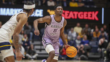 Jan 9, 2024; Morgantown, West Virginia, USA; Kansas State Wildcats guard Cam Carter (5) looks to get the Wildcats offense setup.