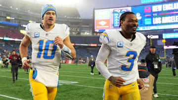 Dec 28, 2024; Foxborough, Massachusetts, USA; Los Angeles Chargers quarterback Justin Herbert (10) and safety Derwin James Jr. (3) run off the field after defeating the New England Patriots in the second half at Gillette Stadium. Mandatory Credit: David Butler II-Imagn Images
