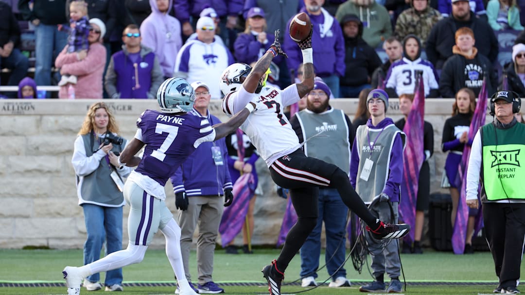 Nov 1, 2025; Manhattan, Kansas, USA; Kansas State Wildcats safety VJ Payne (7) breaks up a pass intended for Texas Tech Red Raiders tight end Terrance Carter Jr. (7) during the second quarter at Bill Snyder Family Football Stadium. Mandatory Credit: Scott Sewell-Imagn Images