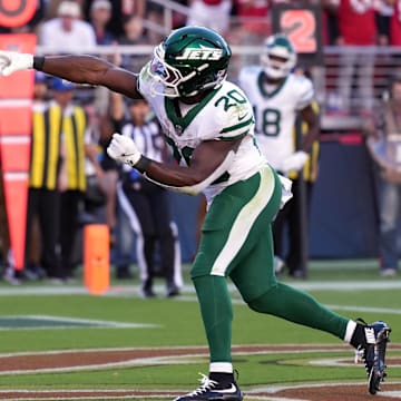 Sep 9, 2024; Santa Clara, California, USA; New York Jets running back Breece Hall (20) throws the ball after scoring a touchdown against the San Francisco 49ers during the first quarter at Levi's Stadium.