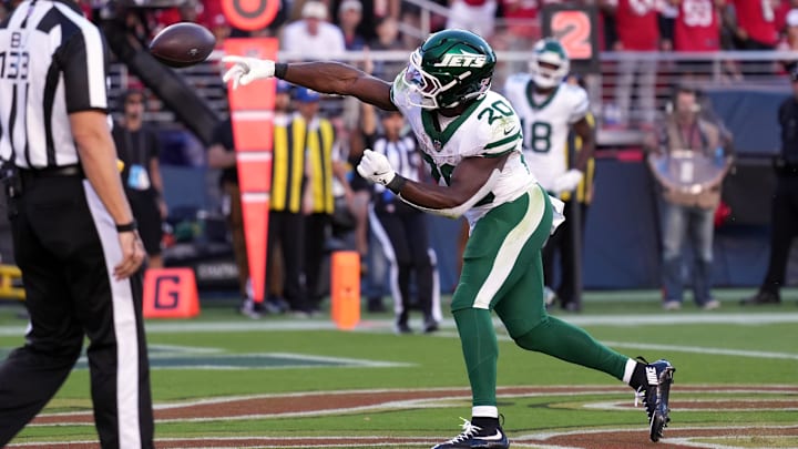 Sep 9, 2024; Santa Clara, California, USA; New York Jets running back Breece Hall (20) throws the ball after scoring a touchdown against the San Francisco 49ers during the first quarter at Levi's Stadium.