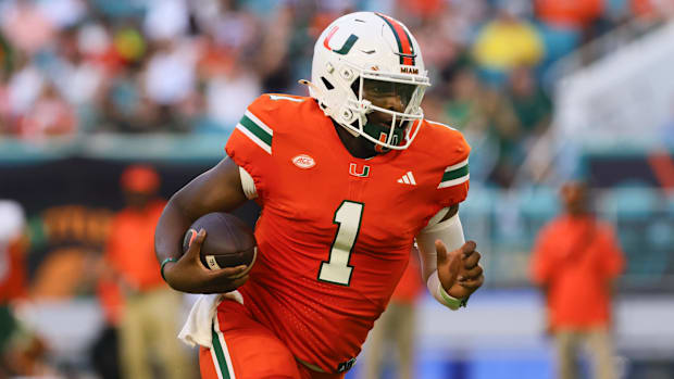 Miami Hurricanes quarterback Cam Ward (1) runs with the football against Florida A&M.