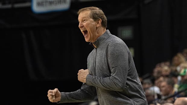 Oregon coach Dana Altman celebrates as the Ducks tie UCLA during the first half at Matthew Knight Arena in Eugene, Oregon