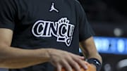 Dec 14, 2024; Cincinnati, Ohio, USA; The Cincinnati and Jordan logo is seen on the shirt of a player during warmups before the game between the Xavier Musketeers and the Cincinnati Bearcats at Fifth Third Arena. Mandatory Credit: Aaron Doster-Imagn Images