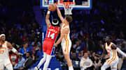 Apr 11, 2025; Philadelphia, Pennsylvania, USA; Atlanta Hawks guard Dyson Daniels (5) blocks a shot from Philadelphia 76ers guard Ricky Council IV (14) in the first quarter at Wells Fargo Center. Mandatory Credit: Kyle Ross-Imagn Images