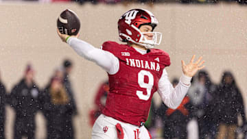 Nov 30, 2024; Bloomington, Indiana, USA; Indiana Hoosiers quarterback Kurtis Rourke (9) drops back to pass the ball  in the first quarter against the Purdue Boilermakers at Memorial Stadium. Mandatory Credit: Trevor Ruszkowski-Imagn Images