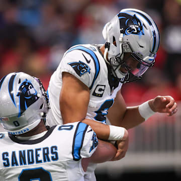 Jan 5, 2025; Atlanta, Georgia, USA; Carolina Panthers quarterback Bryce Young (9) celebrates with tight end Ja'Tavion Sanders (0) after a touchdown run against the Atlanta Falcons in the second quarter at Mercedes-Benz Stadium. Mandatory Credit: Brett Davis-Imagn Images