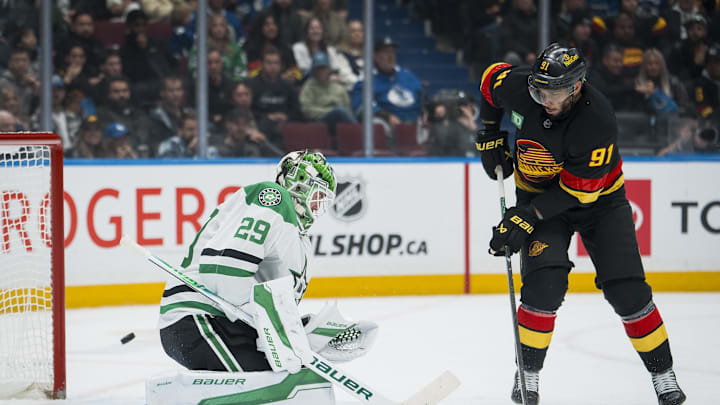 Nov 20, 2025; Vancouver, British Columbia, CAN; Dallas Stars goalie Jake Oettinger (29) makes a save on Vancouver Canucks forward Evander Kane (91) in the second period at Rogers Arena. Mandatory Credit: Bob Frid-Imagn Images