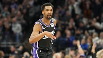 Dec 26, 2024; Sacramento, California, USA; Sacramento Kings guard Malik Monk (0) reacts after scoring a three point basket advantage during the second quarter at Golden 1 Center. Mandatory Credit: Kelley L Cox-Imagn Images