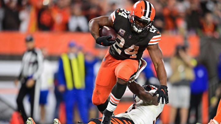 Oct 31, 2022; Cleveland, Ohio, USA; Cleveland Browns running back Nick Chubb (24) steps over Cincinnati Bengals linebacker Germaine Pratt (57) after scoring a touchdown in the fourth quarter at FirstEnergy Stadium.