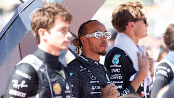 Oct 22, 2023; Austin, Texas, USA;  From left, Charles Leclerc of Ferrari, Lewis Hamilton and Mercedes teammate George Russell before the start of the Formula 1 United States Grand Prix at Circuit of the Americas. Mandatory Credit: Erich Schlegel-Imagn Images