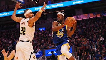 Mar 17, 2025; San Francisco, California, USA: Golden State Warriors forward Jimmy Butler III (10) passes the ball against Denver Nuggets forward Zeke Nnaji (22) during the first quarter at Chase Center. Mandatory Credit: Kelley L Cox-Imagn Images