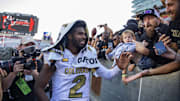 Oct 19, 2024; Tucson, Arizona, USA; Colorado Buffalos quarterback Shedeur Sanders (2) greets fans after defeating the Arizona Wildcats at Arizona Stadium. Mandatory Credit: Mark J. Rebilas-Imagn Images