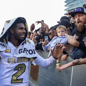 Oct 19, 2024; Tucson, Arizona, USA; Colorado Buffalos quarterback Shedeur Sanders (2) greets fans after defeating the Arizona Wildcats at Arizona Stadium. Mandatory Credit: Mark J. Rebilas-Imagn Images