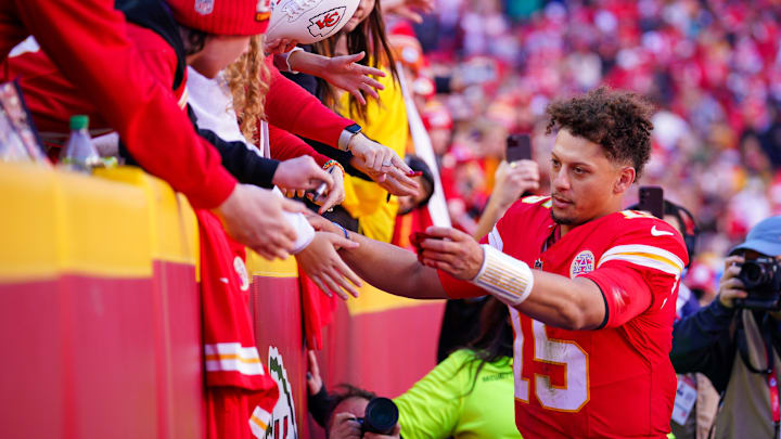 Nov 10, 2024; Kansas City, Missouri, USA; Kansas City Chiefs quarterback Patrick Mahomes (15) greets fans as he leaves the field after the win over the Denver Broncos at GEHA Field at Arrowhead Stadium. Mandatory Credit: Denny Medley-Imagn Images