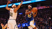 Mar 17, 2025; San Francisco, California, USA; Golden State Warriors forward Jimmy Butler III (10) passes the ball against Denver Nuggets forward Zeke Nnaji (22) during the first quarter at Chase Center. Mandatory Credit: Kelley L Cox-Imagn Images