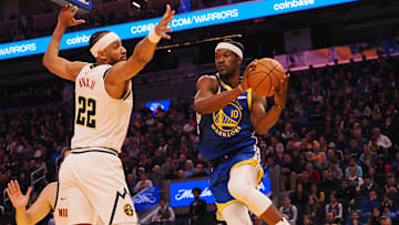 Mar 17, 2025; San Francisco, California, USA; Golden State Warriors forward Jimmy Butler III (10) passes the ball against Denver Nuggets forward Zeke Nnaji (22) during the first quarter at Chase Center. Mandatory Credit: Kelley L Cox-Imagn Images