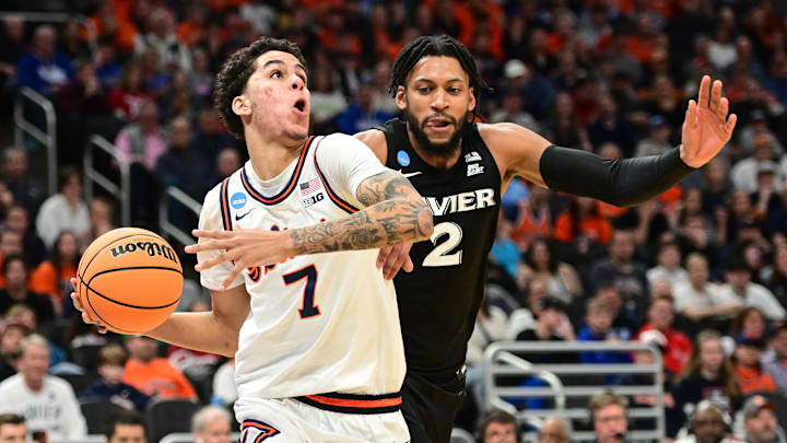 Mar 21, 2025; Milwaukee, WI, USA: Illinois Fighting Illini forward Will Riley (7) drives to the hoop past Xavier Musketeers forward Jerome Hunter (2) during the second half at Fiserv Forum. Mandatory Credit: Benny Sieu-Imagn Images