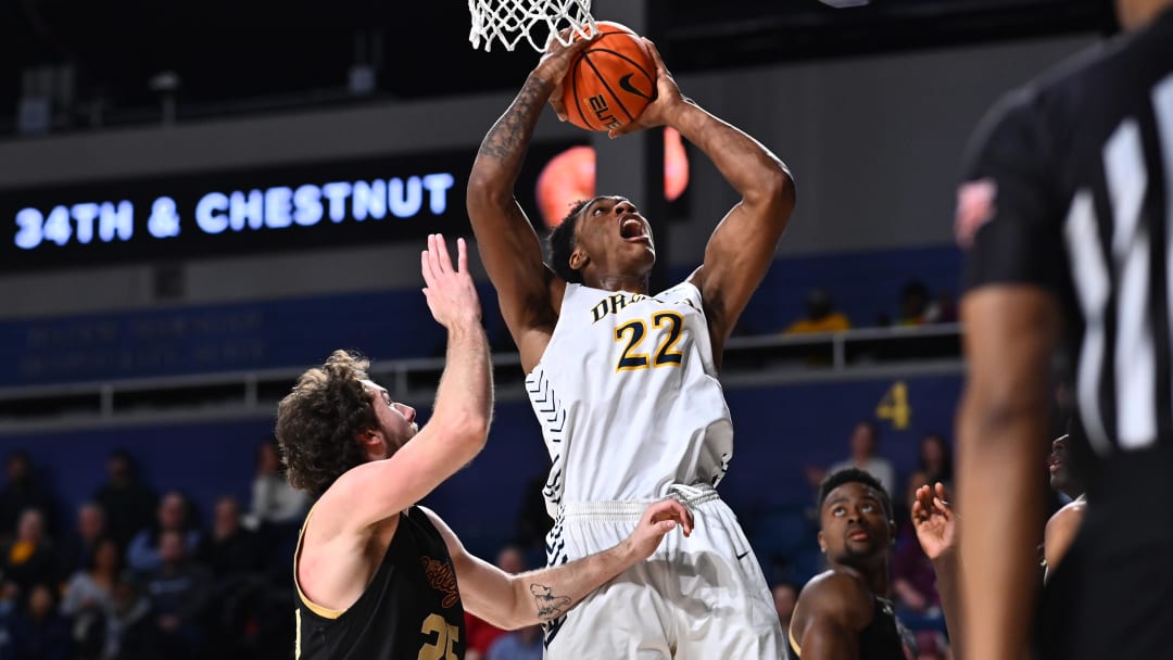 Feb 2, 2023; Philadelphia, Pennsylvania, USA; Drexel Dragons forward Amari Williams (22) shoots over Charleston Cougars forward Ben Burnham (25) in the second half at Daskalakis Athletic Center. Mandatory Credit: Kyle Ross-USA TODAY Sports