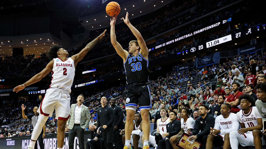 Mar 27, 2025; Newark, NJ, USA; Brigham Young Cougars guard Dallin Hall (30) shoots the ball against Alabama Crimson Tide guard Aden Holloway (2) during the first half during an East Regional semifinal of the 2025 NCAA tournament at Prudential Center. Mandatory Credit: Vincent Carchietta-Imagn Images Mar 27, 2025; Newark, NJ, USA; Brigham Young Cougars guard Dallin Hall (30) shoots the ball against Alabama Crimson Tide guard Aden Holloway (2) during the first half during an East Regional semifinal of the 2025 NCAA tournament at Prudential Center. Mandatory Credit: Vincent Carchietta-Imagn Images