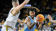 Feb 23, 2025; Wichita, Kansas, USA; Tulane Green Wave forward Gregg Glenn III (2) drives to the basket during the first half against the Wichita State Shockers at Charles Koch Arena. 