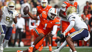 Nov 9, 2024; Atlanta, Georgia, USA; Miami Hurricanes quarterback Cam Ward (1) scrambles against the Georgia Tech Yellow Jackets in the second quarter at Bobby Dodd Stadium at Hyundai Field. Mandatory Credit: Brett Davis-Imagn Images