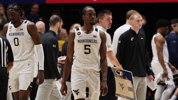 West Virginia University guard Toby Okani